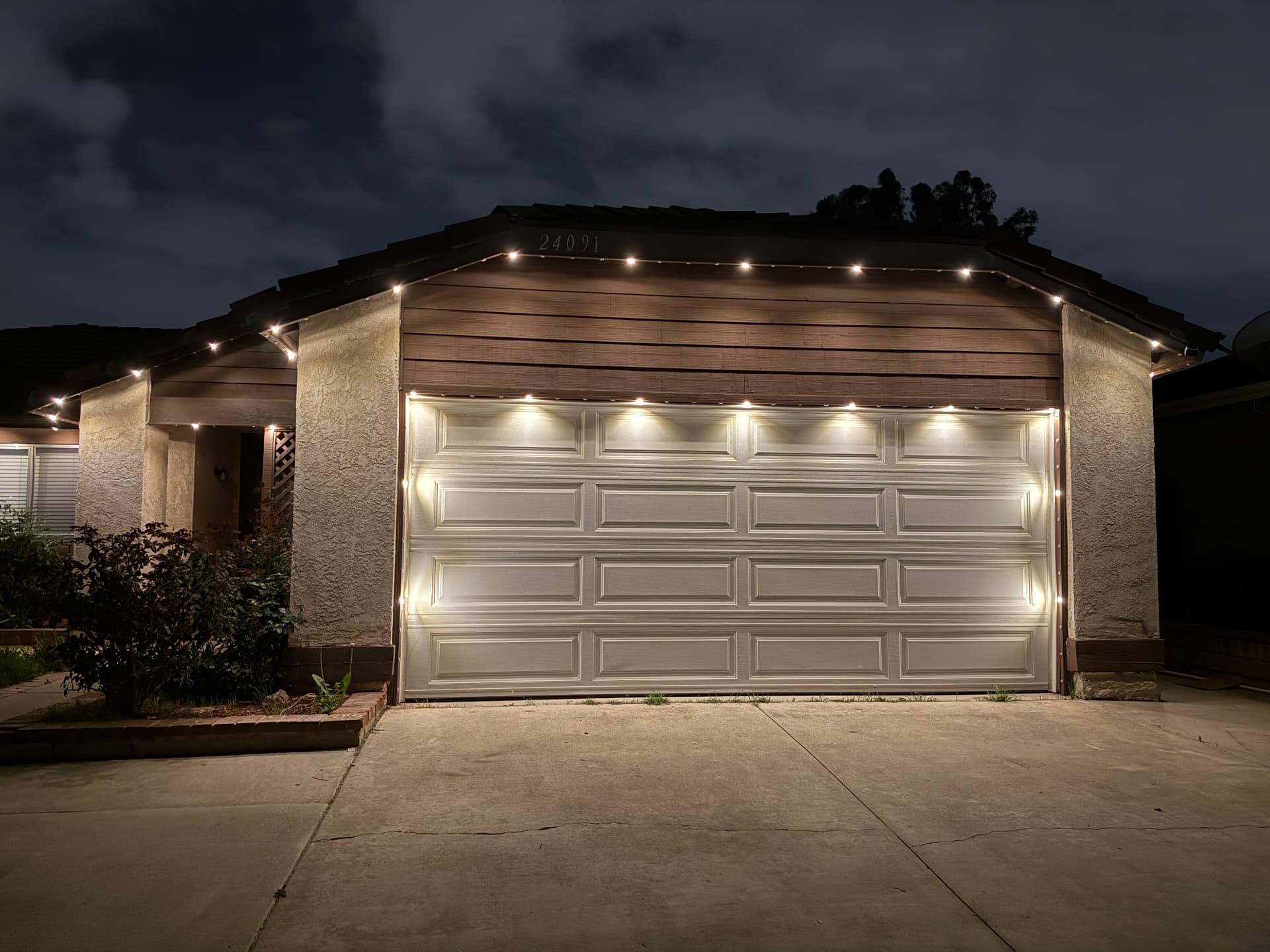 Warm white roofline lighting on a residential home